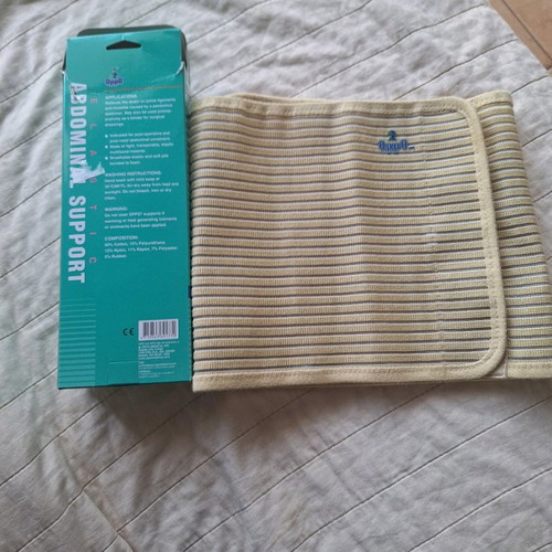 Postoperative abdominal support belt used, size M