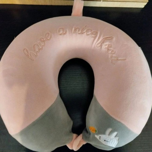 Children's neck pillow like new, with second needing zipper replacement