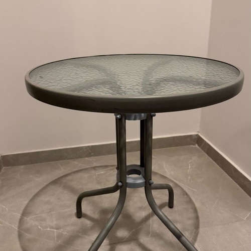 Round balcony table like new with metal frame and glass top