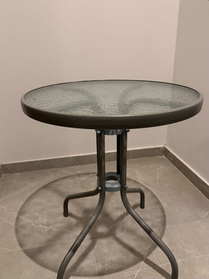 Round balcony table like new with metal frame and glass top