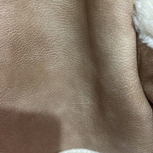 Edited beige coat with fur lining, new with tags