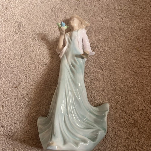Porcelain figurine doll like new, height 25 cm
