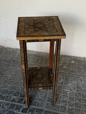 Wooden decorative table with carvings used, vintage style