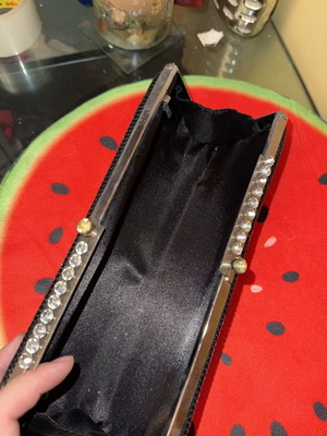 Black evening clutch bag with metallic details