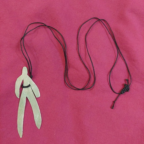 Handmade necklace used with human figure shape and adjustable cord