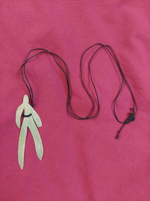 Handmade necklace used with human figure shape and adjustable cord