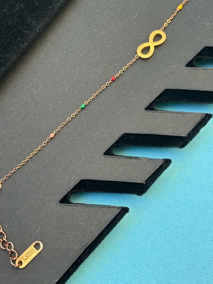 Bracelet with infinity symbol and colorful stones stainless steel like new