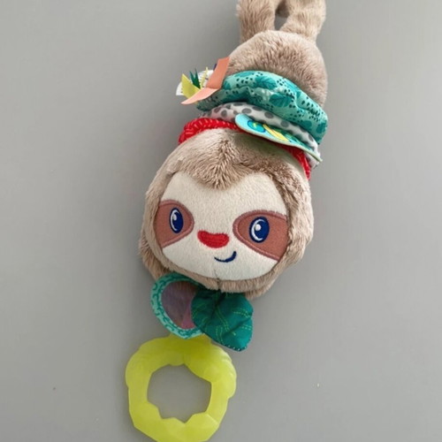 Musical hanging teddy bear like new with teether and lullaby