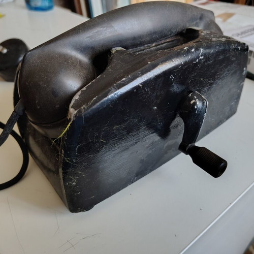Vintage telephone used with crank, possibly military or service from 70s