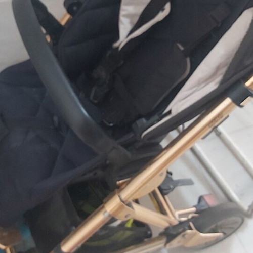 Mamas & Papas baby stroller with some wear on wheels and canopy