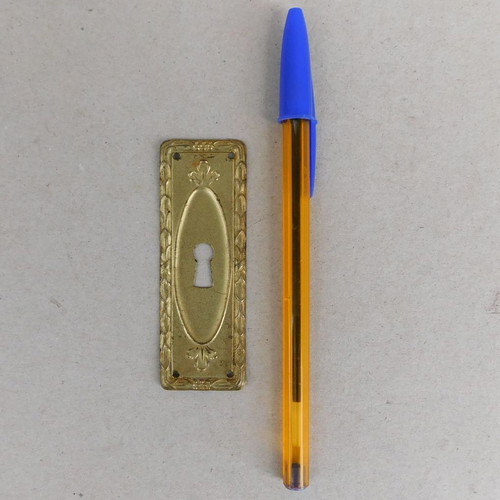Decorative brass covers for furniture locks