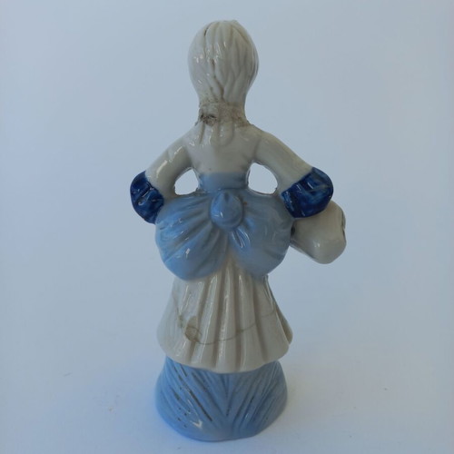 Porcelain figurine used with peasant girl