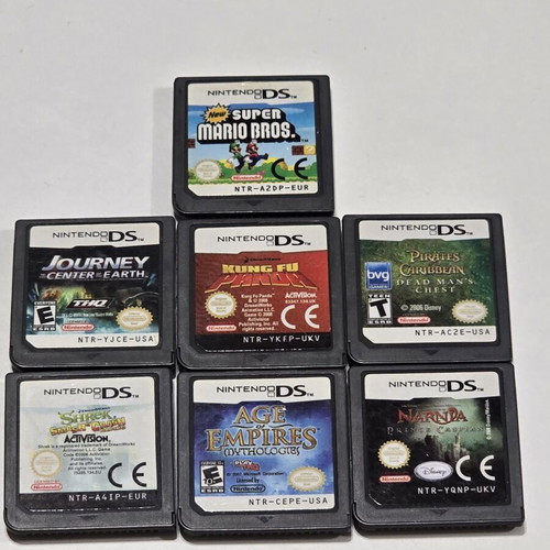 Nintendo DSi black console pack used with 7 games, charger and travel case