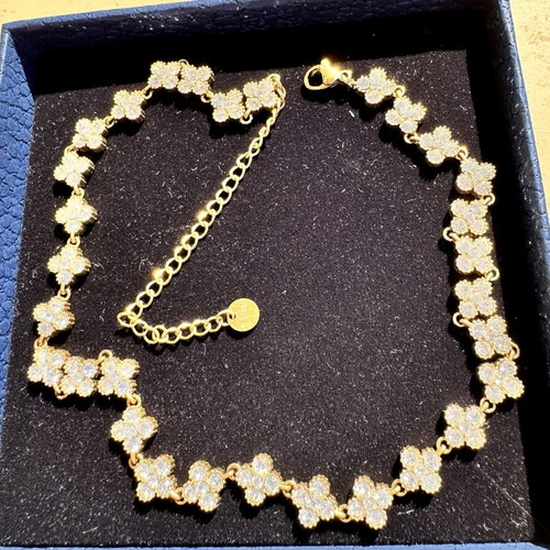 Steel necklace with zircon like new, gold color