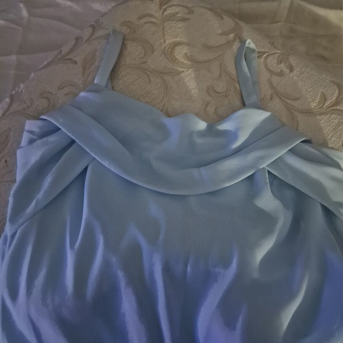 Sleeveless baby blue dress with cowl neck and asymmetric ruffle