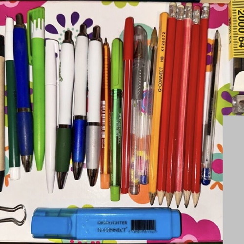 Various stationery items used, pack with pens, hole punch, pencils