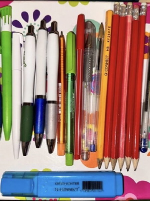 Various stationery items used, pack with pens, hole punch, pencils