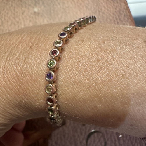 Tennis bracelet with multicolored round rhinestones and secure clasp