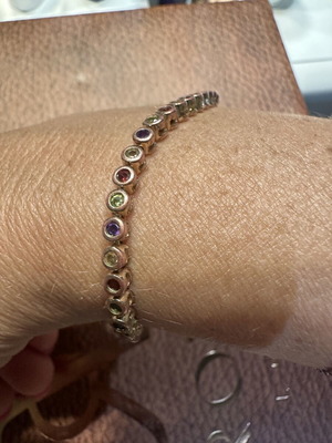 Tennis bracelet with multicolored round rhinestones and secure clasp