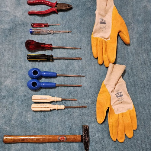 Hand tool set used with screwdrivers, pliers, hammer and work gloves