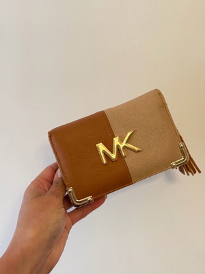 Elegant wallet with multiple compartments and wrist strap like new