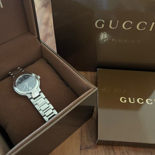 Gucci women's watch silver like new with box and booklet