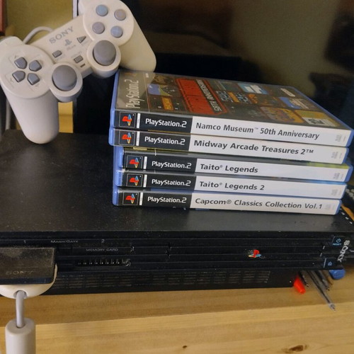 Sony PlayStation 2 used with games, joystick and memory card