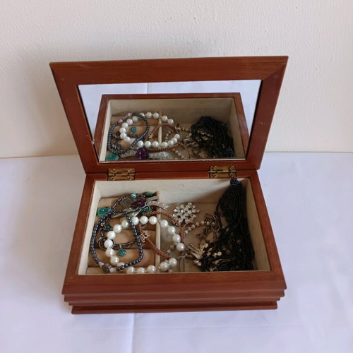 Vintage wooden jewelry box with jewelry used