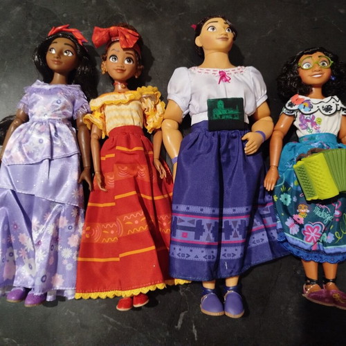 Disney Store Encanto dolls like new, all together