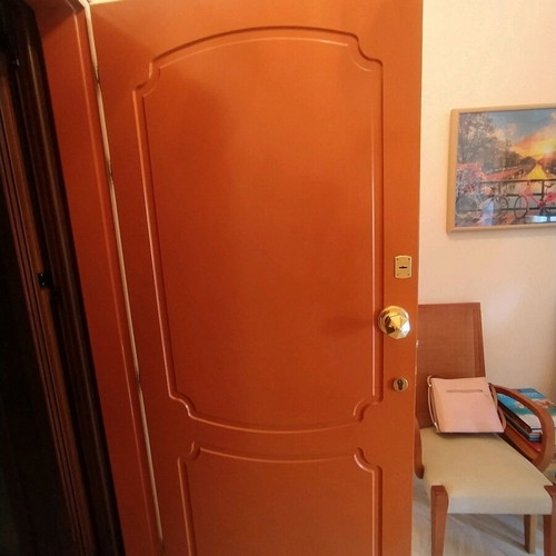 Lacquered entrance door used, terracotta exterior, white interior