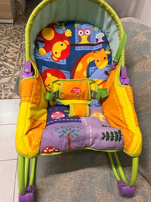 Baby swing chair like new with safety belts and animal print