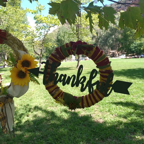 Handmade autumn decorative wreath with wooden thankful sign