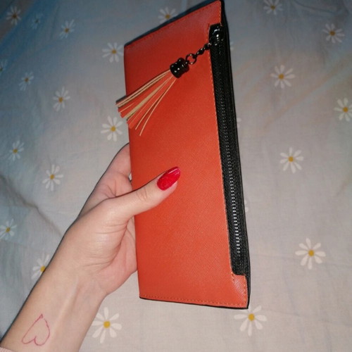 Orange wallet with six card slots and two bill compartments