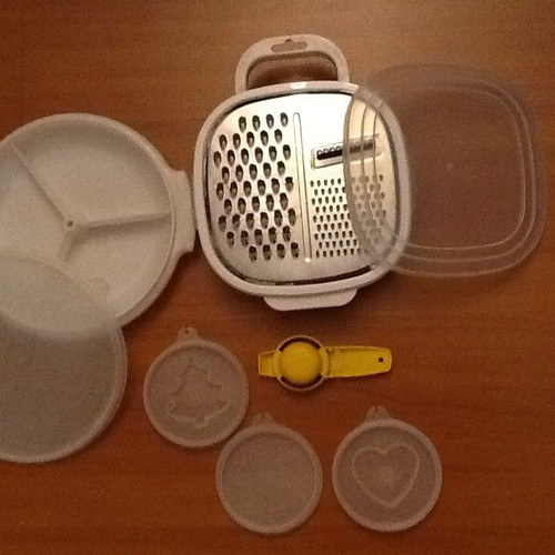 Set of three kitchen containers and stainless steel grater