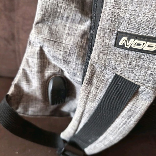 NOD anti-theft backpack used, gray with laptop compartment and USB