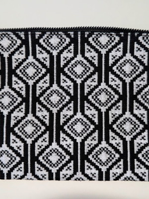 Kerastase fabric toiletry bag like new with geometric patterns in black and white