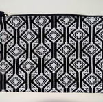 Kerastase fabric toiletry bag like new with geometric patterns in black and white