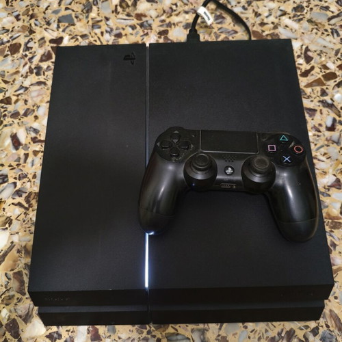 PlayStation 4 500GB console with controller and 3 games