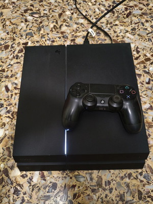 PlayStation 4 500GB console with controller and 3 games