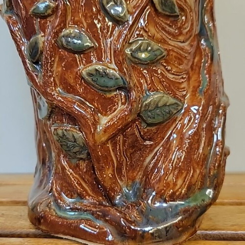 Handmade ceramic vase with natural decorative elements