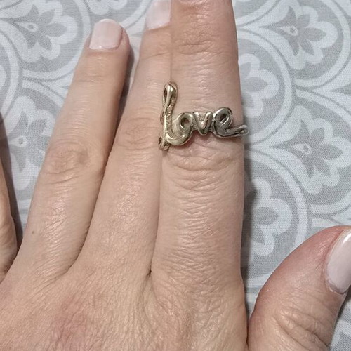 Love ring in gold tone like new