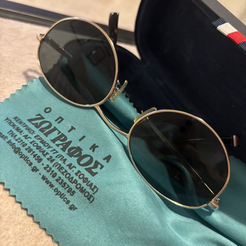 Tommy Hilfiger sunglasses with gold frame and dark lenses