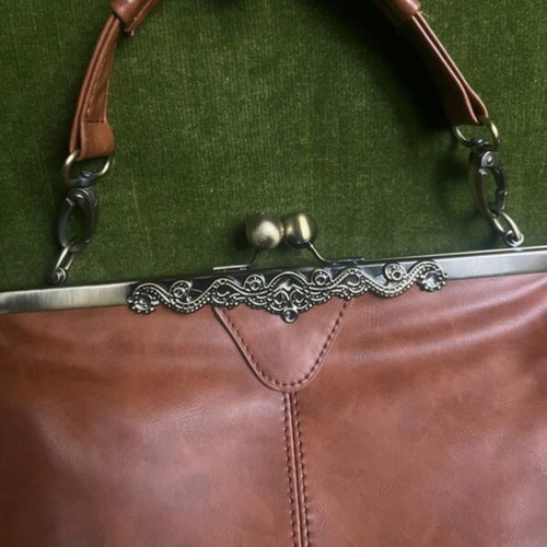 Vintage leather handbag like new, brown with bronze details