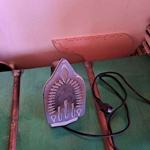 Steam iron used, as shown