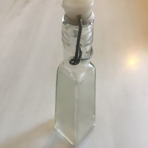 Small glass bottle with airtight seal like new