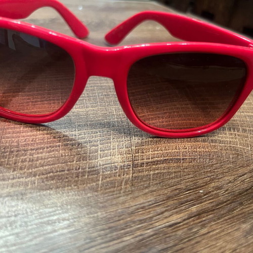 Sunglasses with red-pink frame, recently replaced lenses