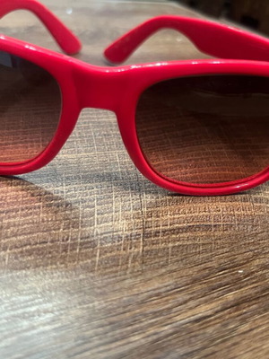 Sunglasses with red-pink frame, recently replaced lenses
