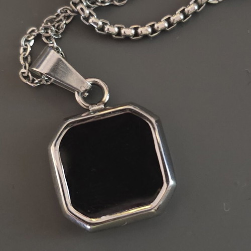Silver necklace with geometric pendant and black stone, like new