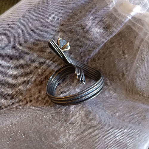 Handmade ring of oxidized silver with white topaz like new