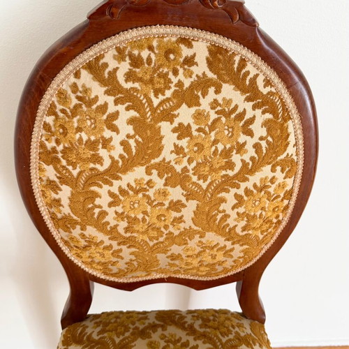 Chair used with wooden frame and brown velour fabric with floral pattern